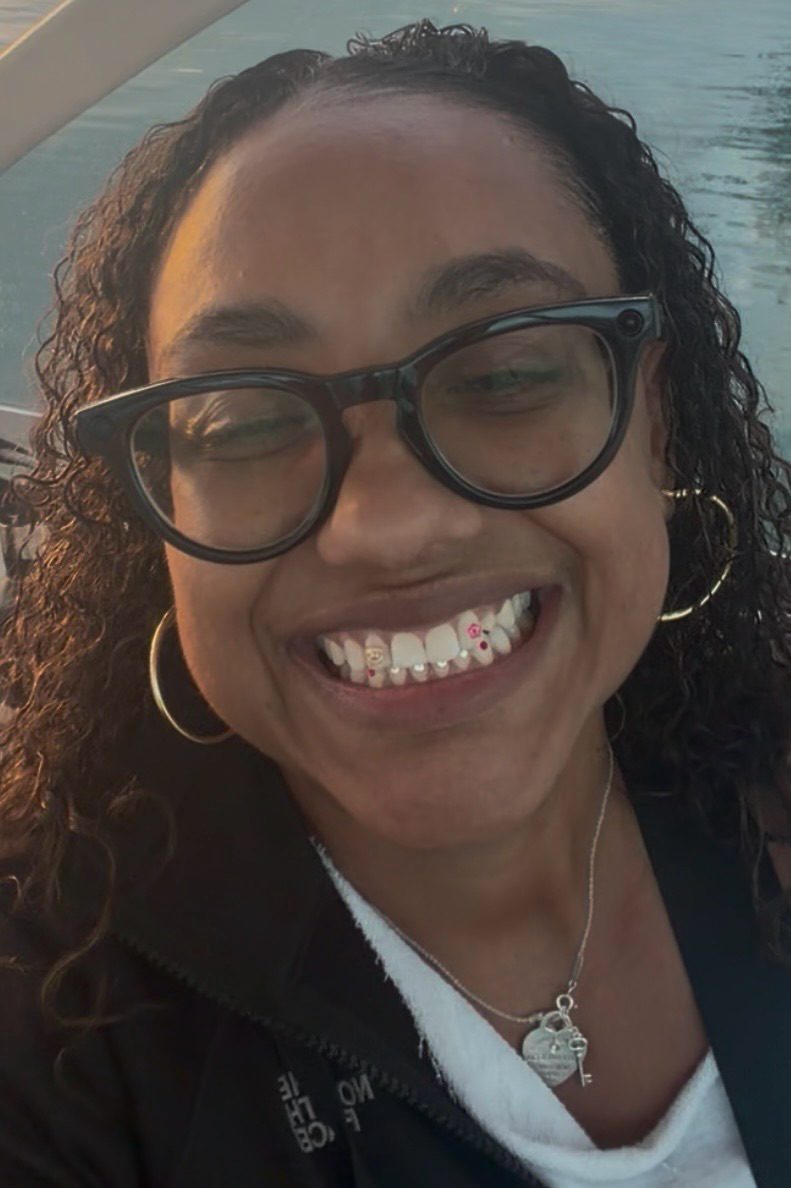 Anita Ferebee smiling, with crystal and gold tooth gems